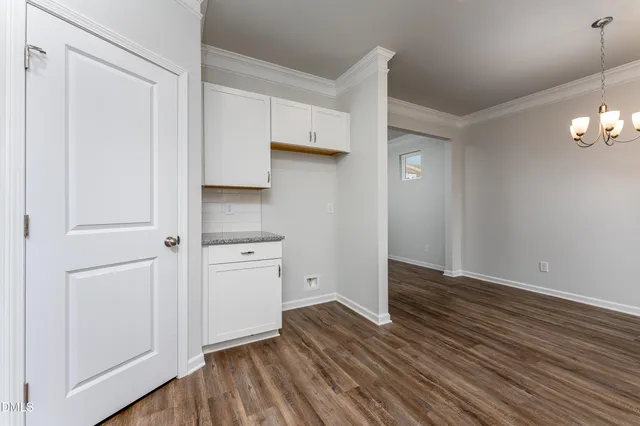 a view of cabinets and wooden floor