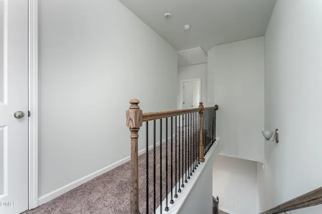 a view of a hallway with a white walls