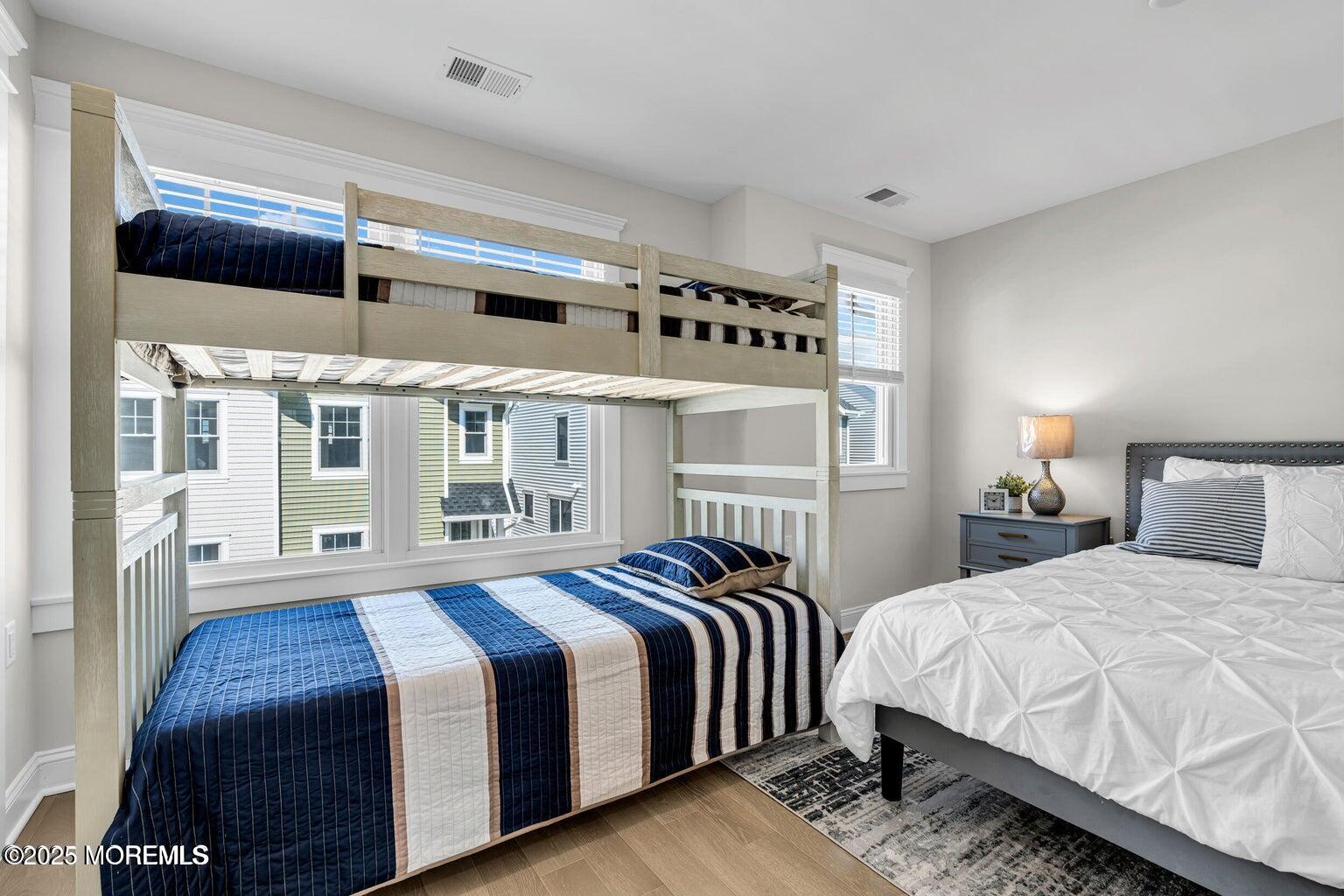 6 Shell Road Mantoloking, NJ 08738 - Photo 18 of 54 a bedroom with double bed and a large window