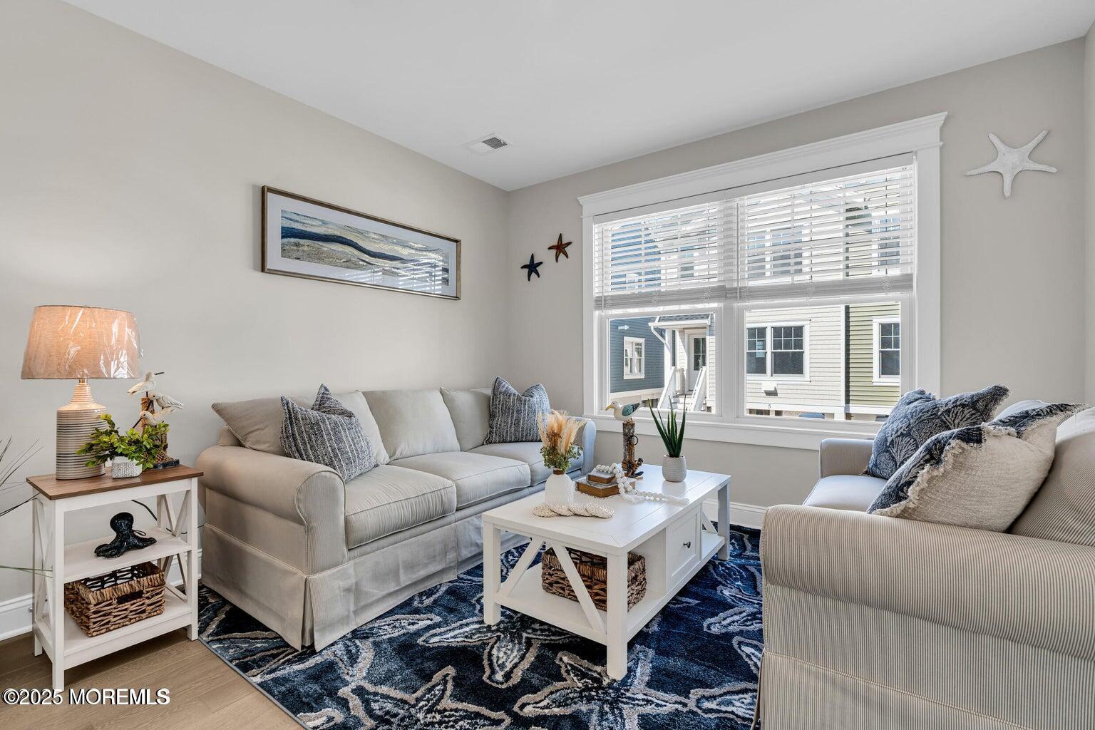 6 Shell Road Mantoloking, NJ 08738 - Photo 4 of 54 a living room with furniture a table and a large window