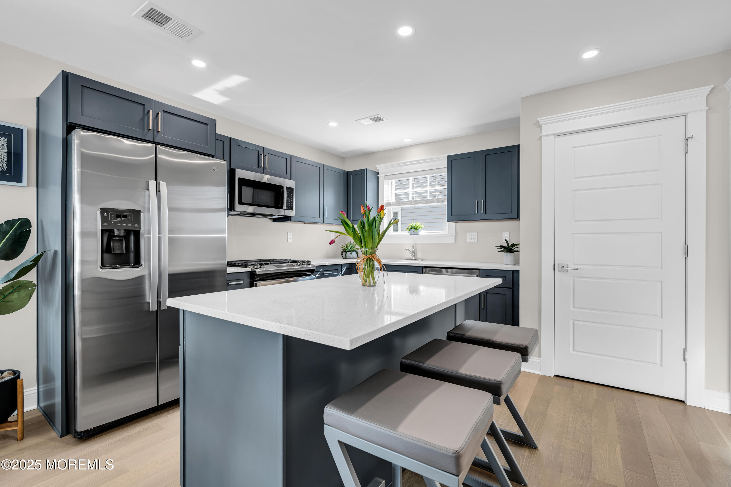 6 Shell Road Mantoloking, NJ 08738 - Photo 7 of 54 a kitchen with stainless steel appliances kitchen island a refrigerator and a sink