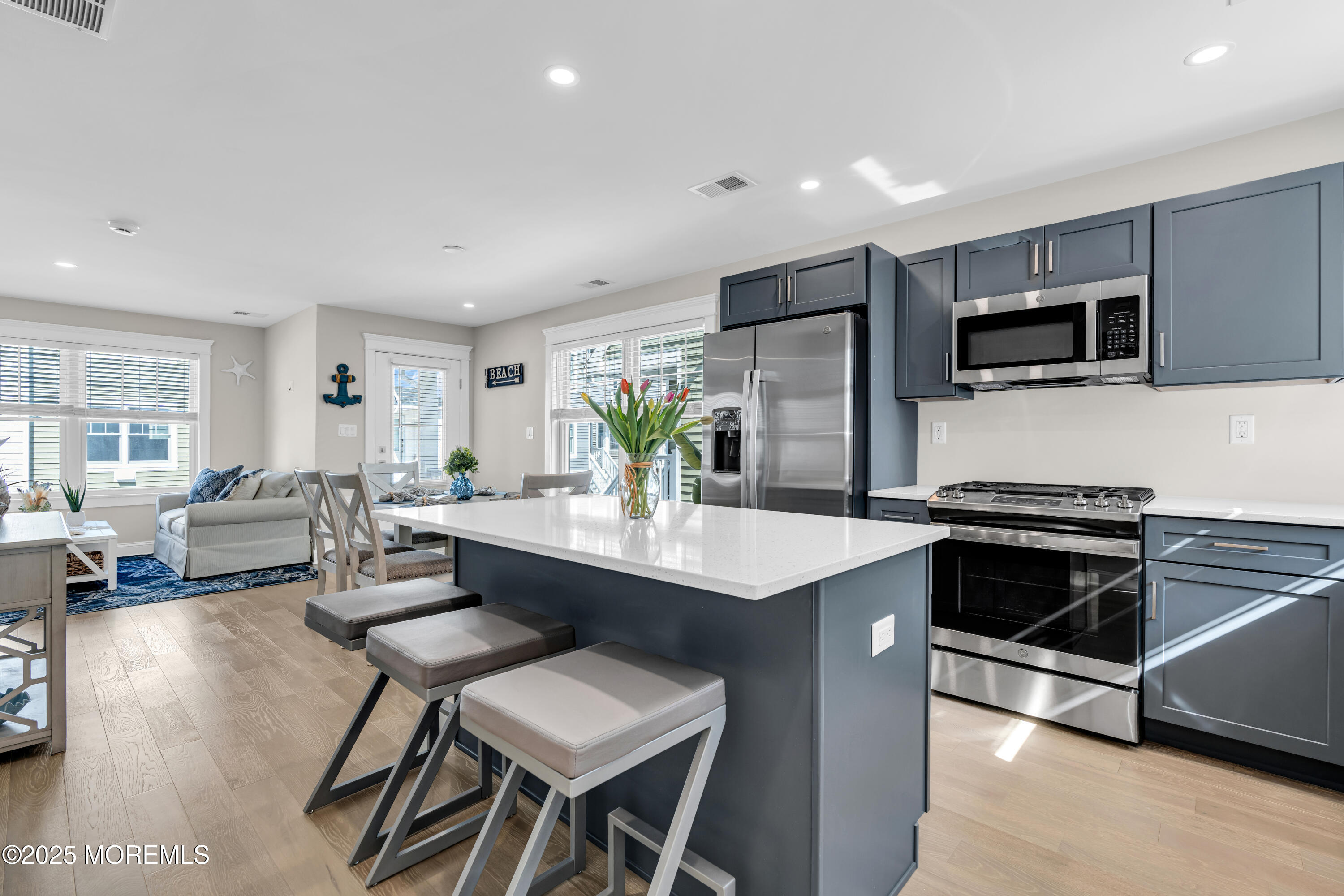 6 Shell Road Mantoloking, NJ 08738 - Photo 8 of 54 a kitchen with stainless steel appliances kitchen island granite countertop a sink and cabinets