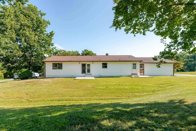 a view of a house with a big yard