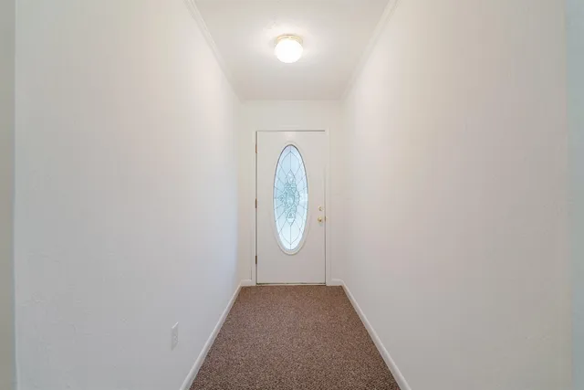 a view of a hallway with windows