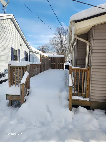 a view of a patio with a table and chairs