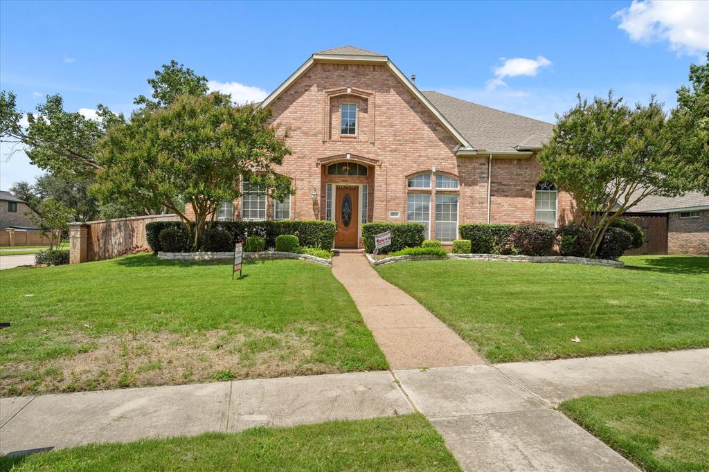 403 Hampton Drive Coppell, TX 75019 - Photo 1 of 1 a front view of a house with a yard