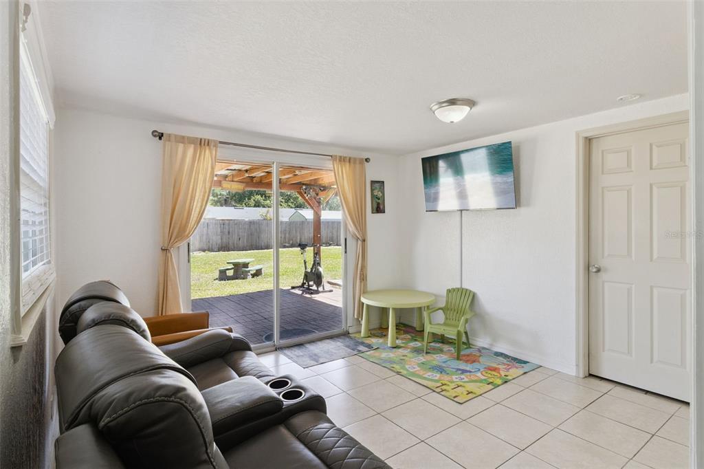 303 Granada Road Auburndale, FL 33823 - Photo 14 of 25 a living room with furniture and a window
