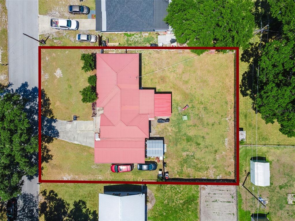 303 Granada Road Auburndale, FL 33823 - Photo 21 of 25 an aerial view of a house with a yard and garden