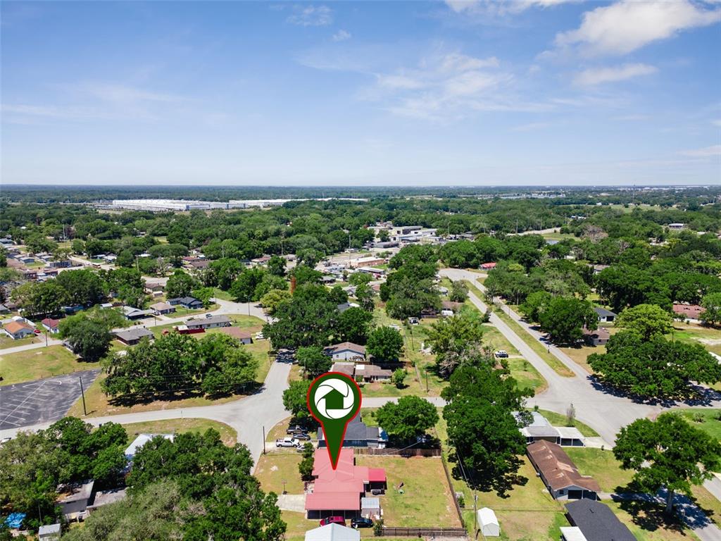 303 Granada Road Auburndale, FL 33823 - Photo 23 of 25 an aerial view of a city and mountain view in back
