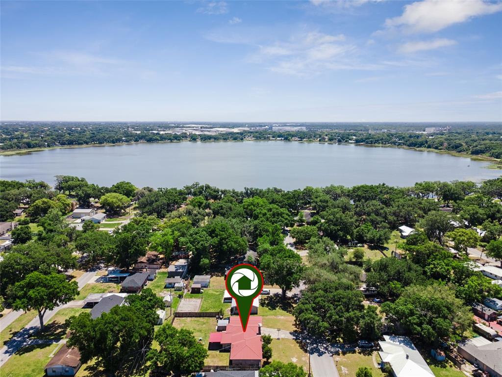 303 Granada Road Auburndale, FL 33823 - Photo 24 of 25 a aerial view of a house with a lake view