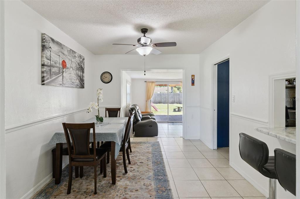 303 Granada Road Auburndale, FL 33823 - Photo 4 of 25 a view of a dining room with furniture and a chandelier