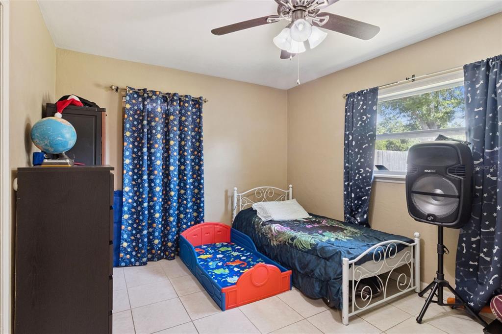 303 Granada Road Auburndale, FL 33823 - Photo 10 of 25 a living room with furniture and a chandelier