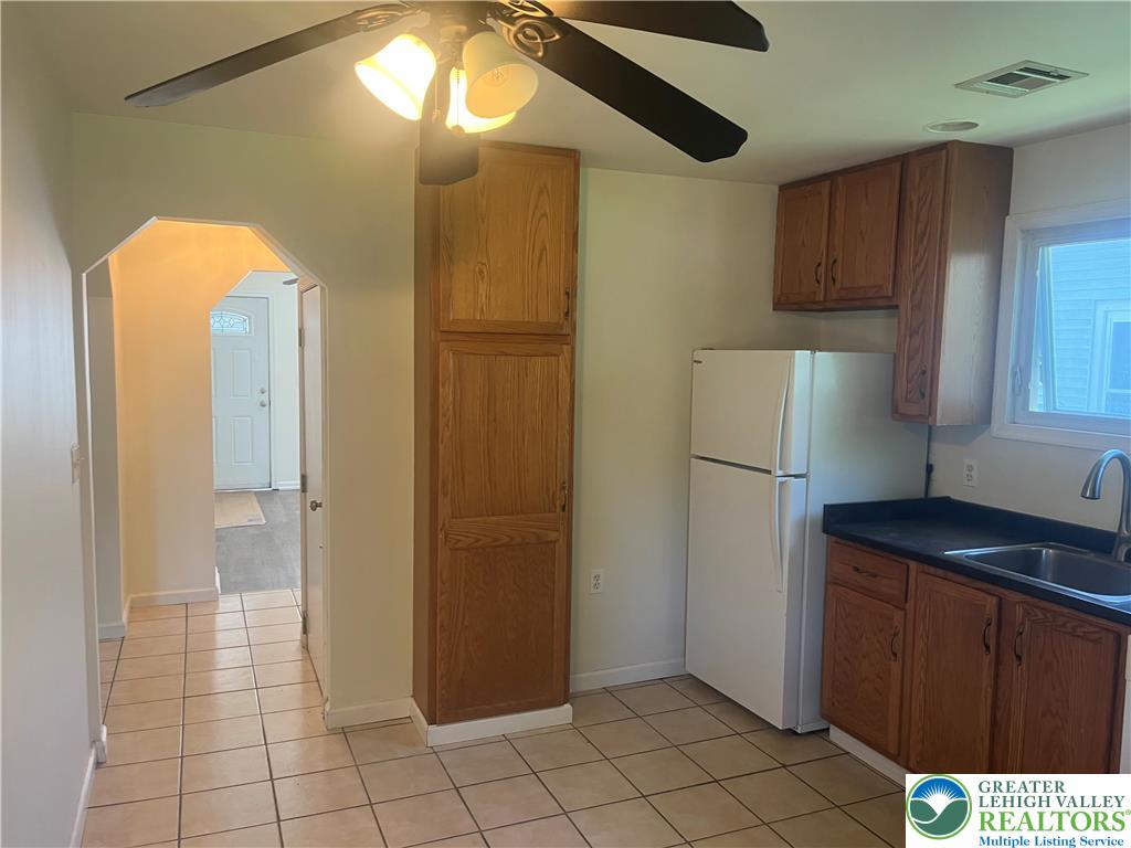 1839 Willow Park Road Bethlehem, PA 18020 - Photo 6 of 35 Functional kitchen with ample cabinetry and easy-to-maintain tiled floors, perfect for everyday living.