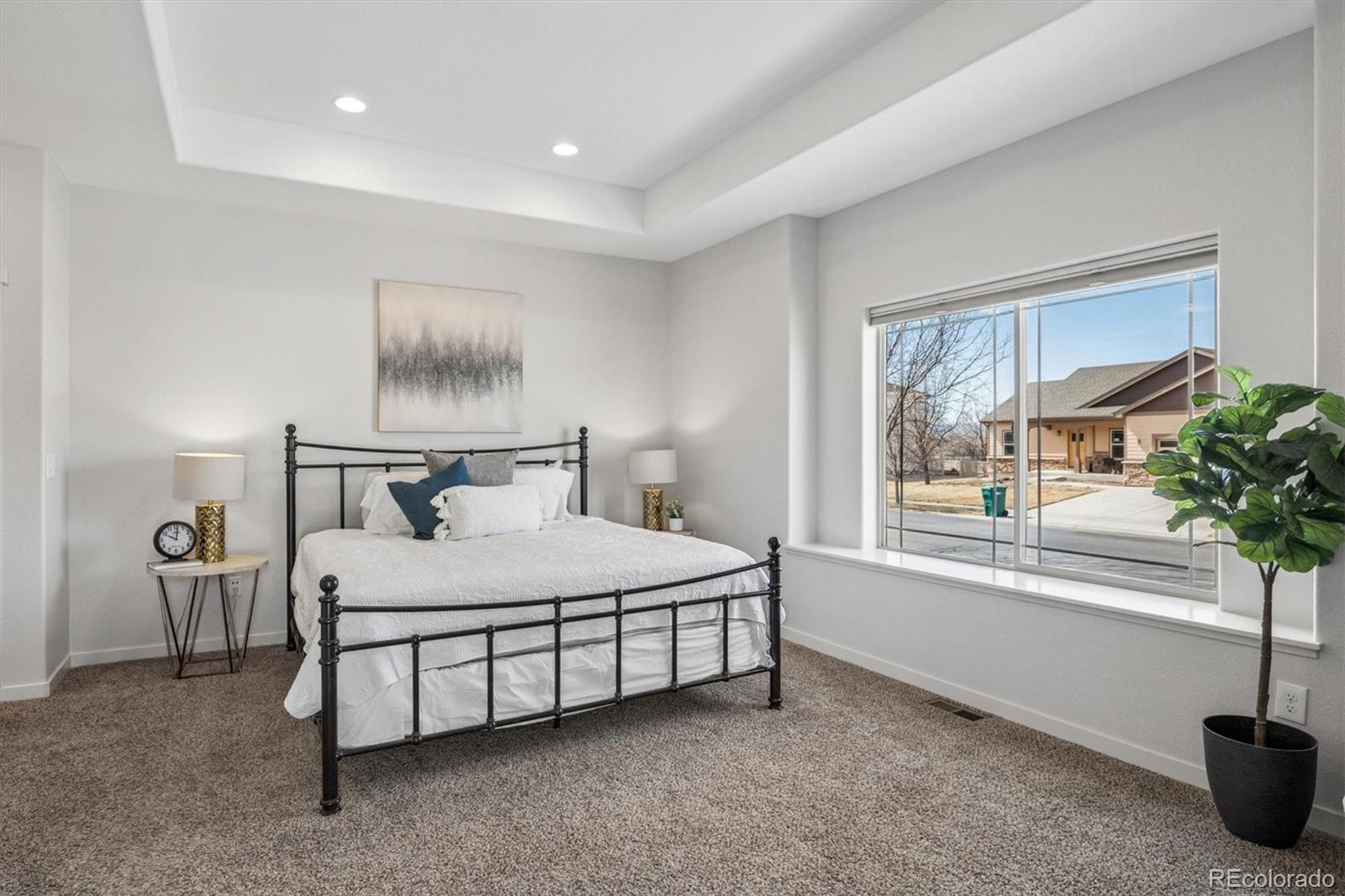 3674 Watts Street Timnath, CO 80547 - Photo 13 of 50 a bedroom with a bed and a window