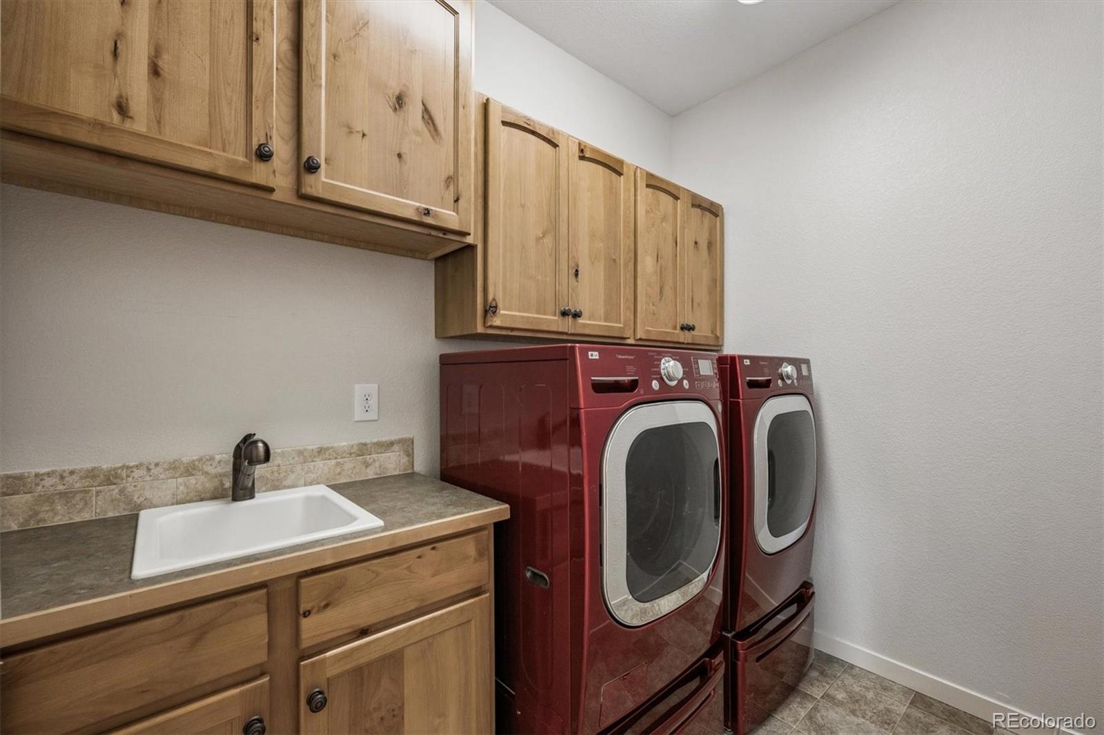 3674 Watts Street Timnath, CO 80547 - Photo 17 of 50 a utility room with dryer and washer