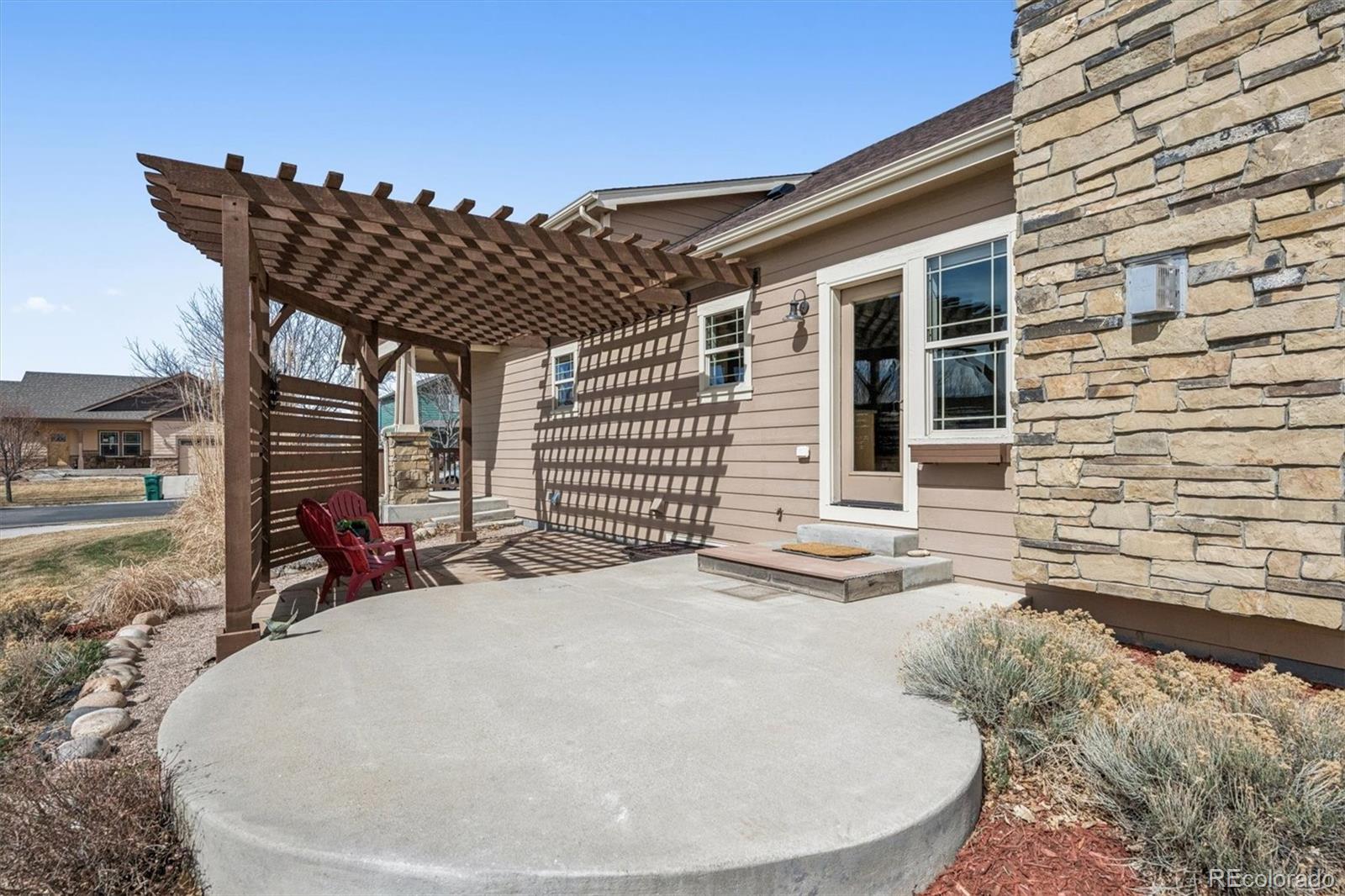 3674 Watts Street Timnath, CO 80547 - Photo 24 of 50 a view of a house with a patio