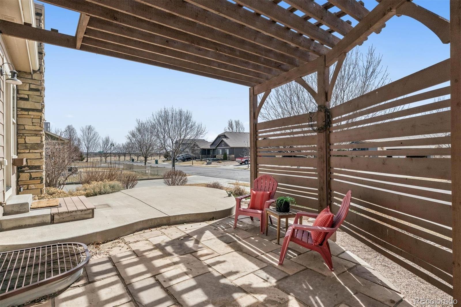 3674 Watts Street Timnath, CO 80547 - Photo 25 of 50 a building outdoor space with patio furniture