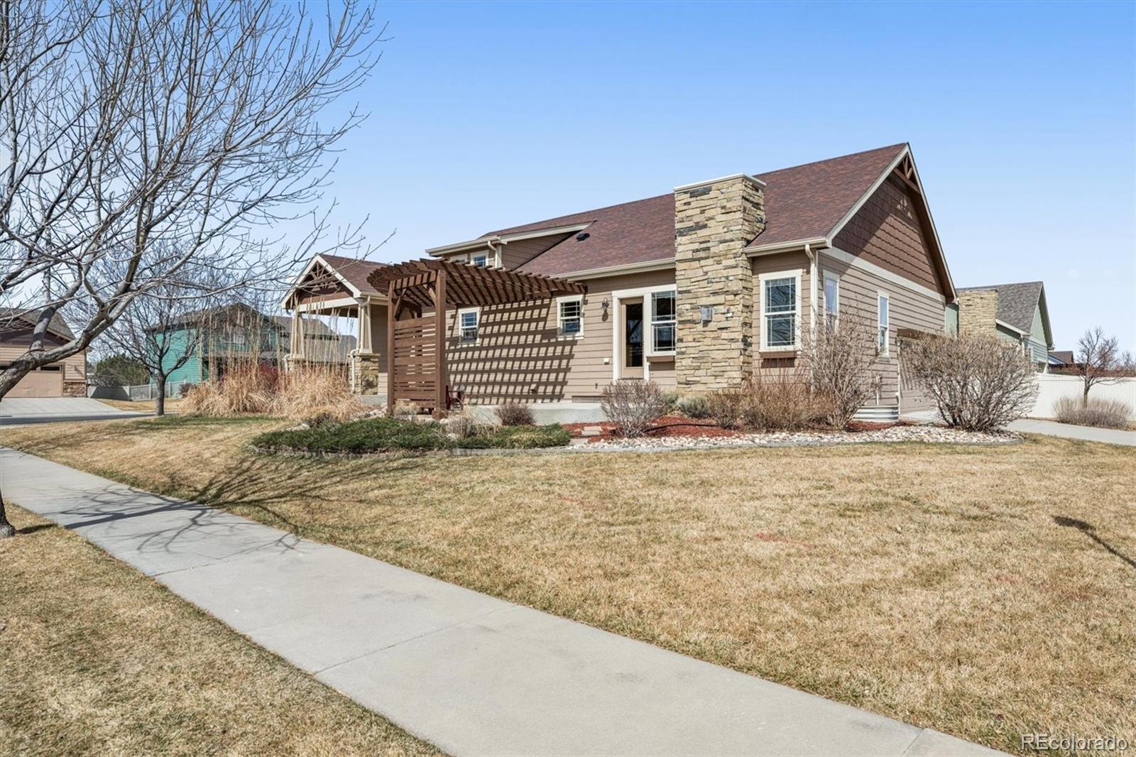 3674 Watts Street Timnath, CO 80547 - Photo 26 of 50 a house that has a tree in front of it
