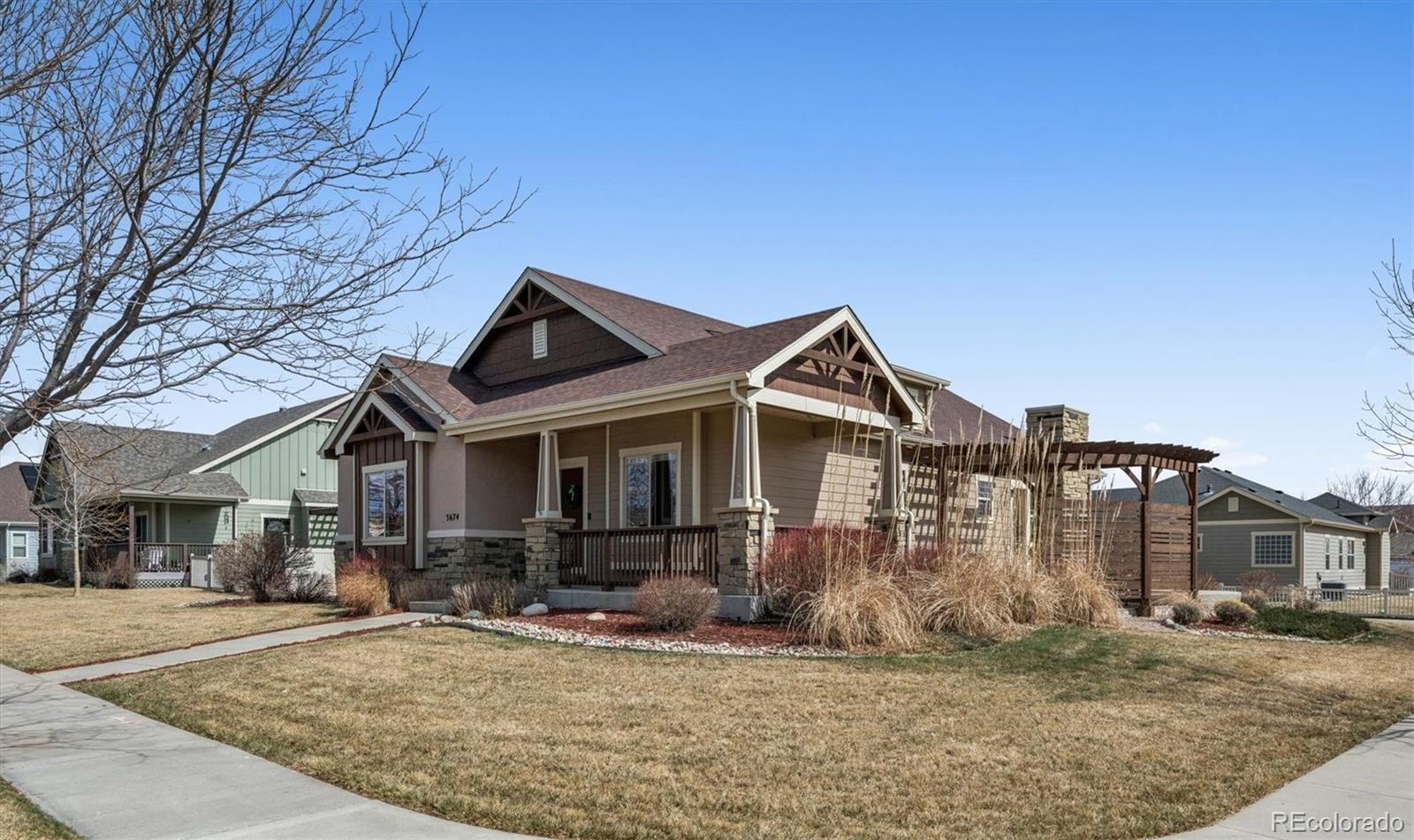 3674 Watts Street Timnath, CO 80547 - Photo 3 of 50 a front view of a house with garden