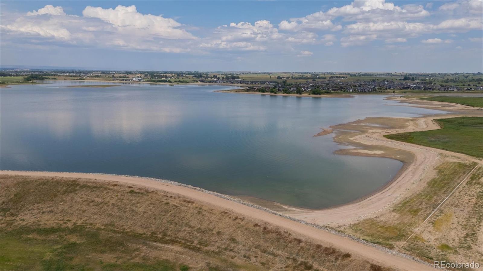 3674 Watts Street Timnath, CO 80547 - Photo 40 of 50 a view of a lake in front of house