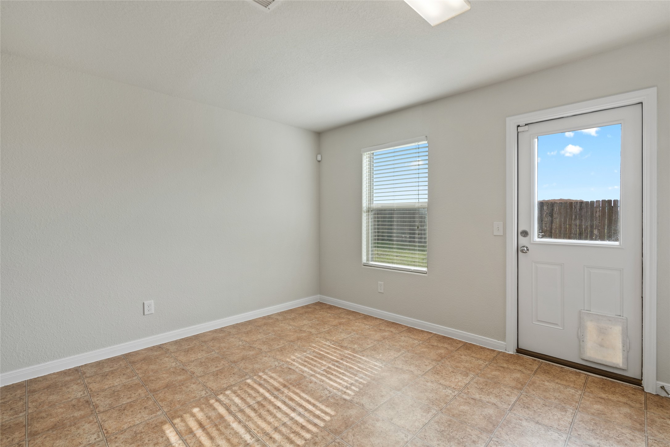 1323 Pease River Lane Rosenberg, TX 77471 - Photo 13 of 31 an empty room with a window