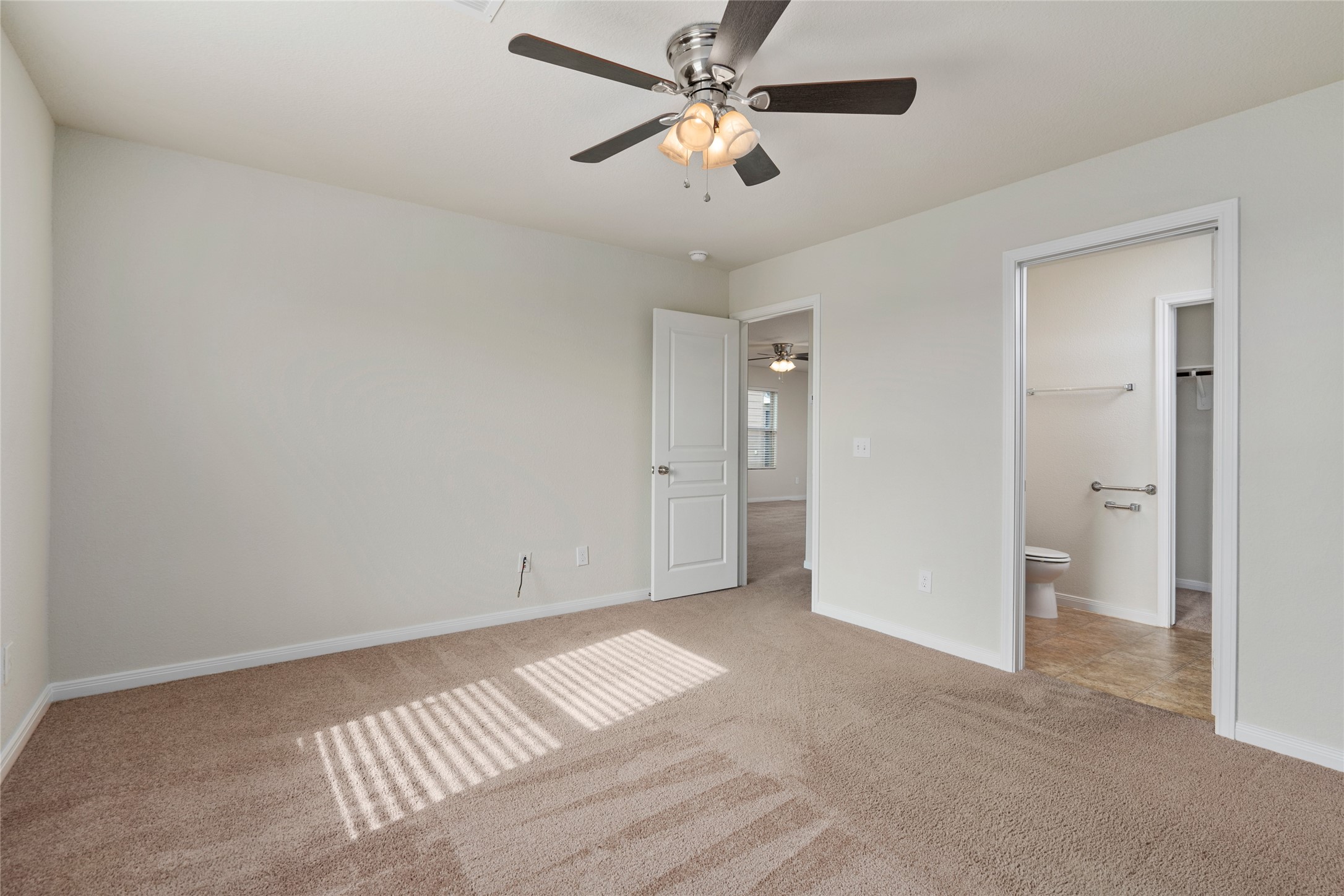 1323 Pease River Lane Rosenberg, TX 77471 - Photo 14 of 31 wooden floor in an empty room with a chandelier fan