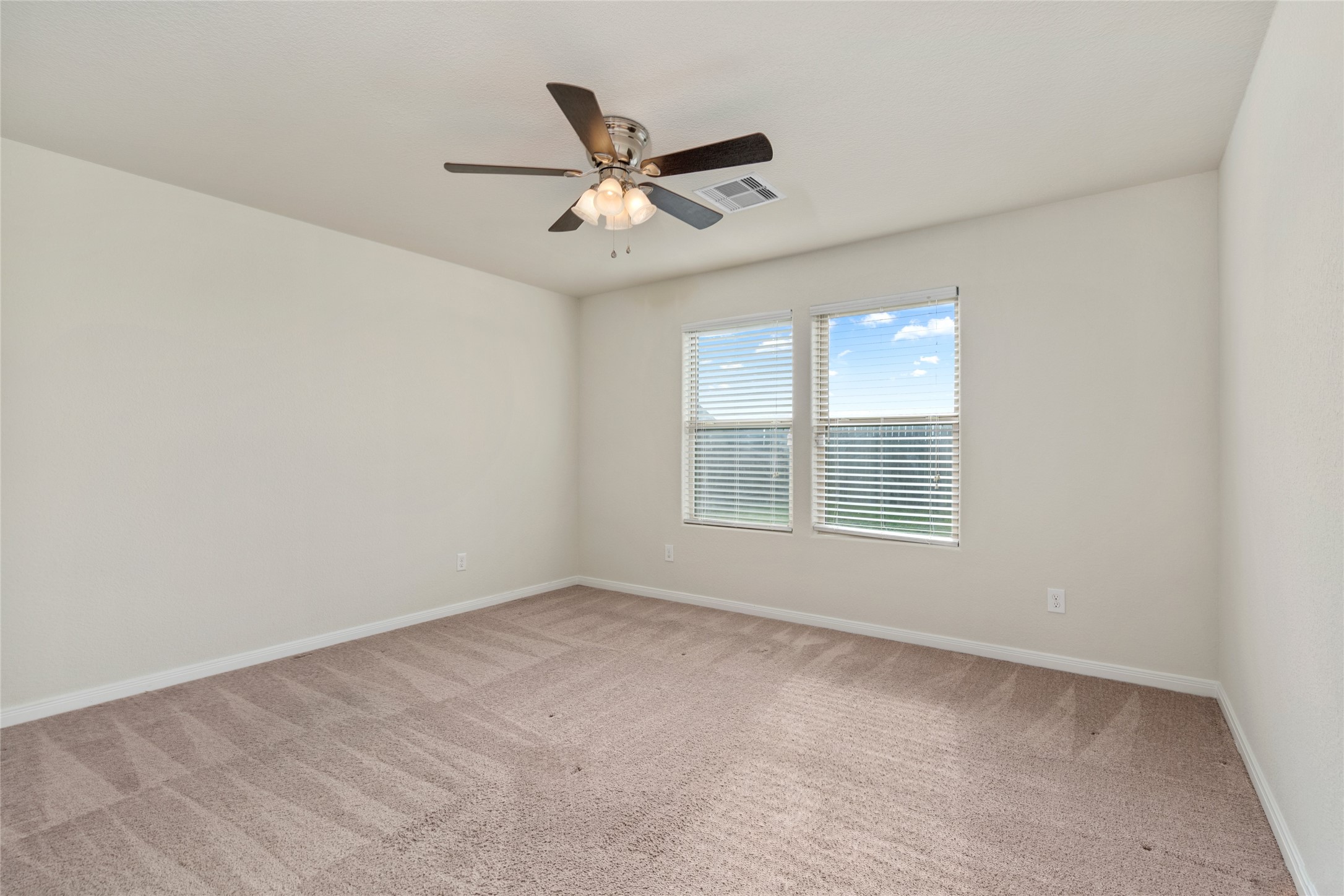 1323 Pease River Lane Rosenberg, TX 77471 - Photo 16 of 31 a view of an empty room with a window