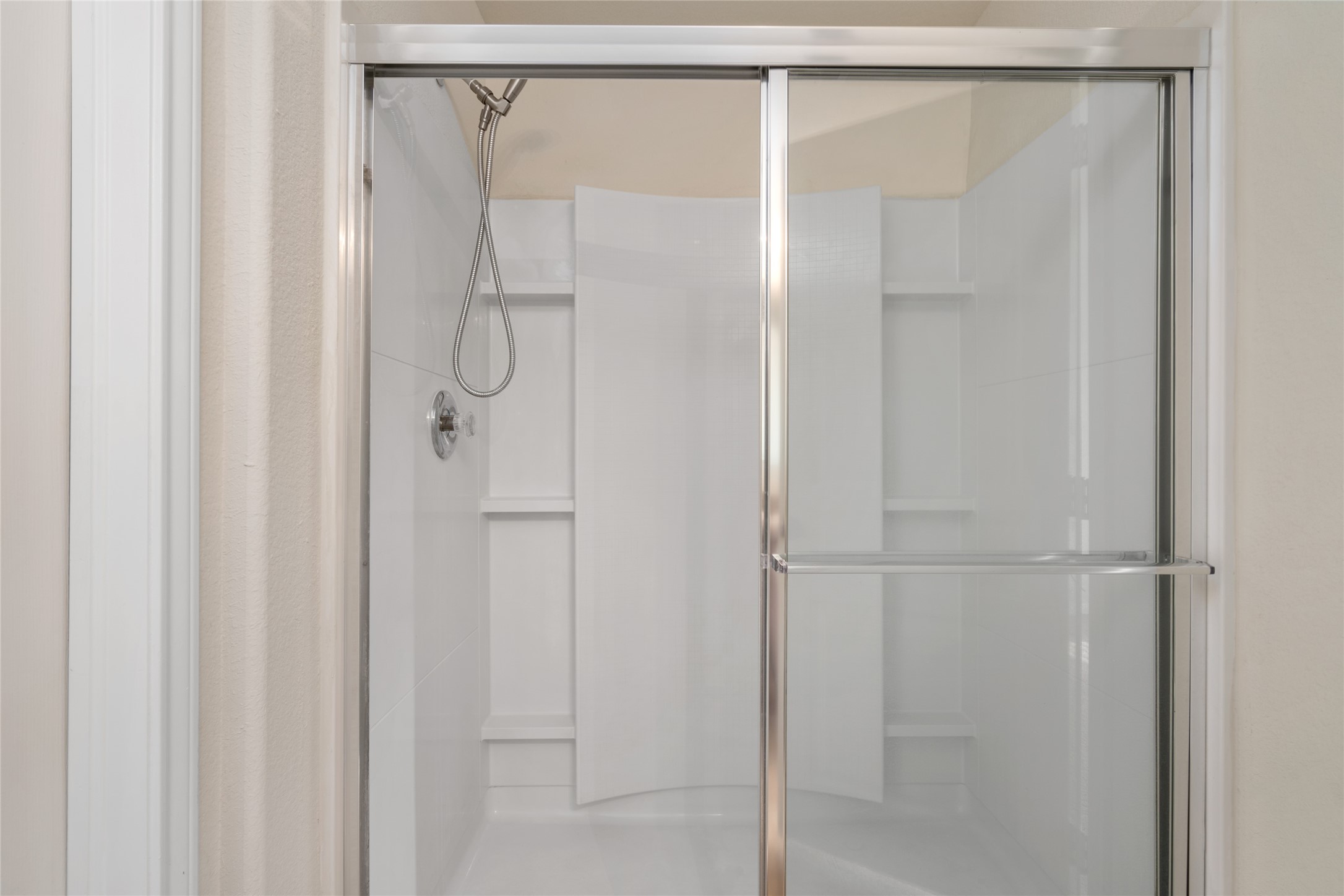 1323 Pease River Lane Rosenberg, TX 77471 - Photo 18 of 31 a bathroom with a glass shower door