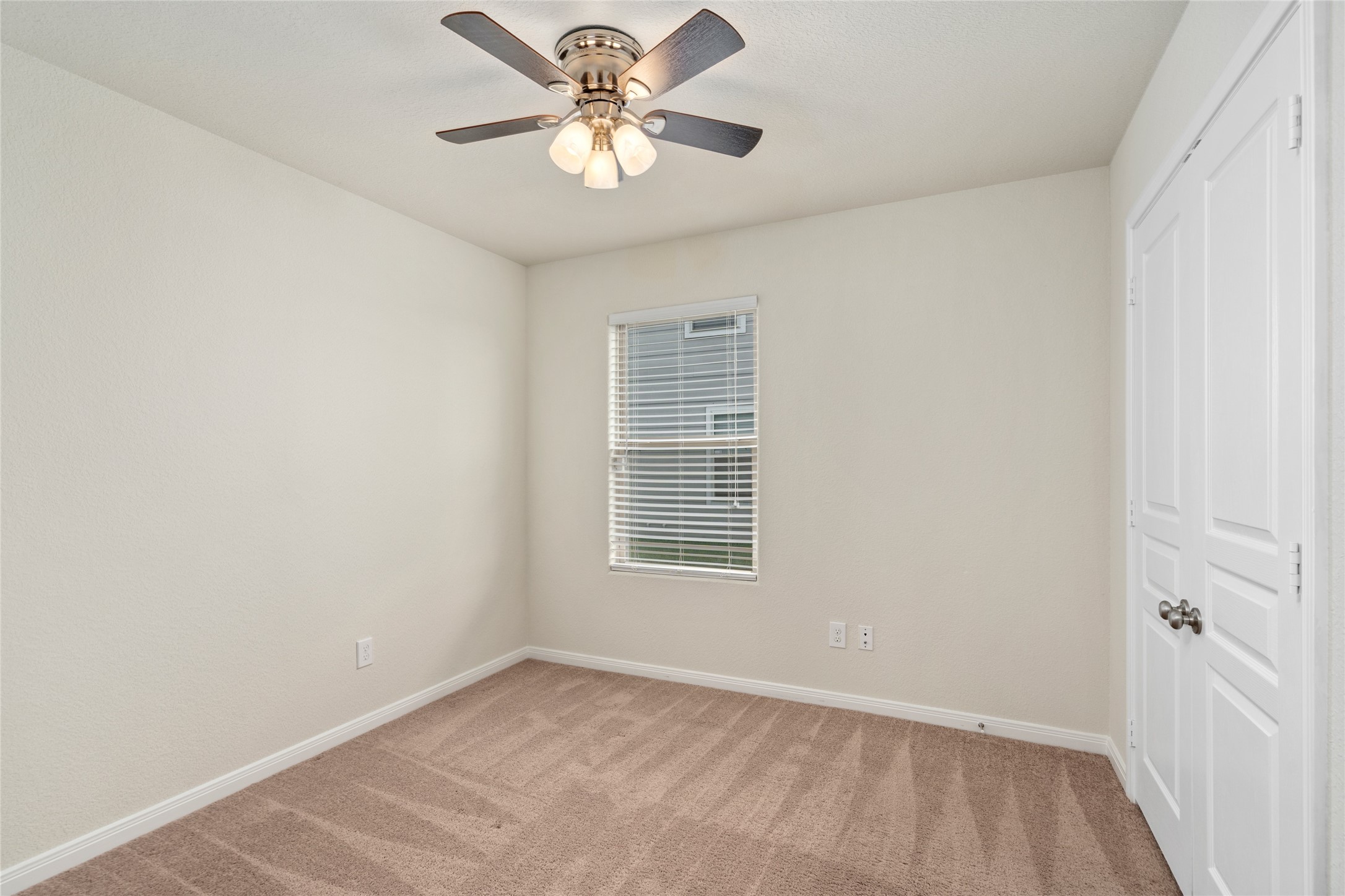 1323 Pease River Lane Rosenberg, TX 77471 - Photo 20 of 31 an empty room with a window and a fan