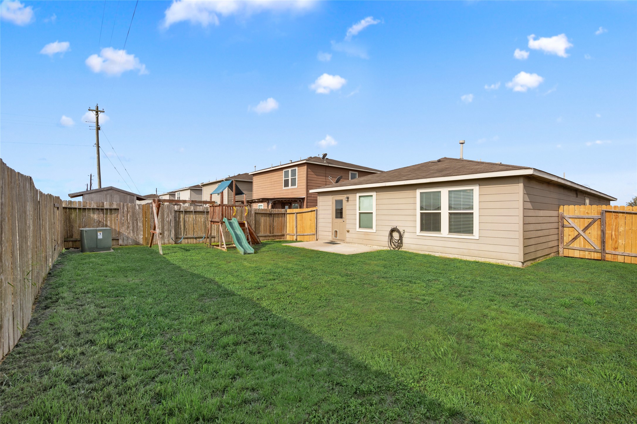 1323 Pease River Lane Rosenberg, TX 77471 - Photo 26 of 31 a view of a house with backyard and garden