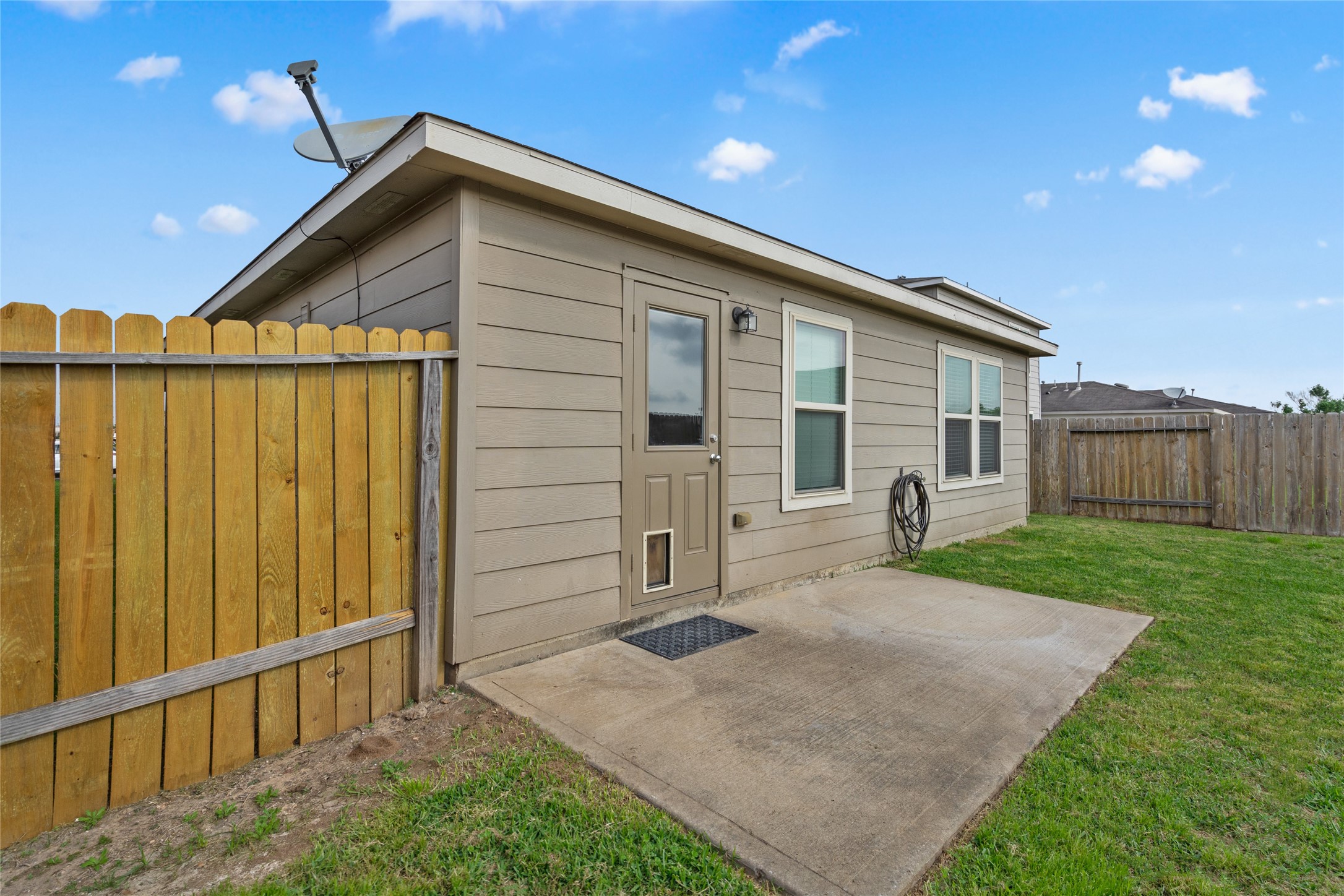 1323 Pease River Lane Rosenberg, TX 77471 - Photo 30 of 31 a view of backyard of house with wooden fence