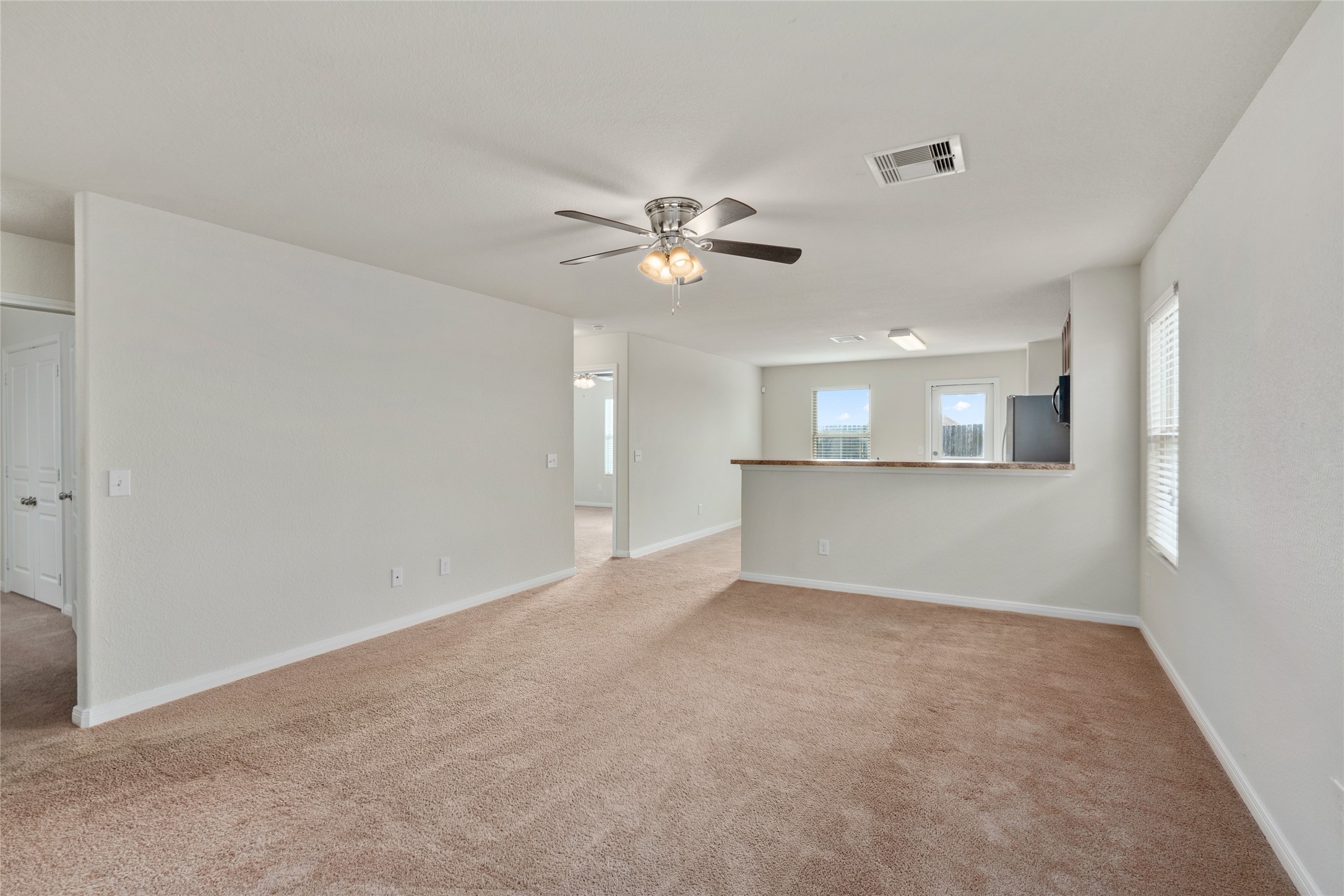 1323 Pease River Lane Rosenberg, TX 77471 - Photo 6 of 31 an empty room with a view of a kitchen