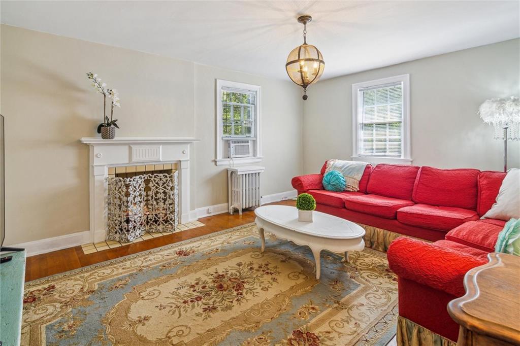 346 Midway Road Pittsburgh, PA 15216 - Photo 27 of 47 a living room with furniture a fireplace and a window