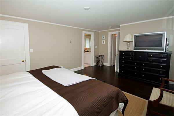23 Pine Plain Road Wellesley, MA 02481 - Photo 15 of 26 a bedroom with a bed and a flat screen tv
