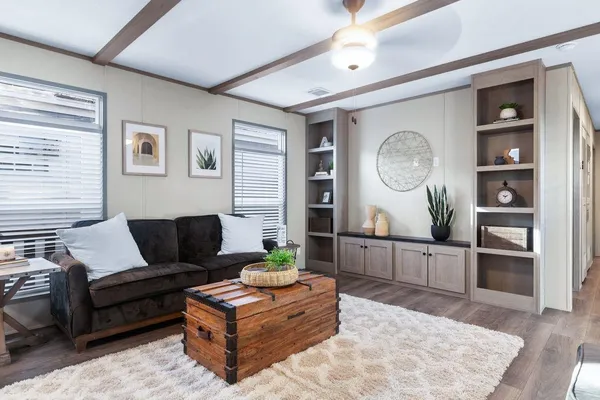 a living room with furniture and wooden floor
