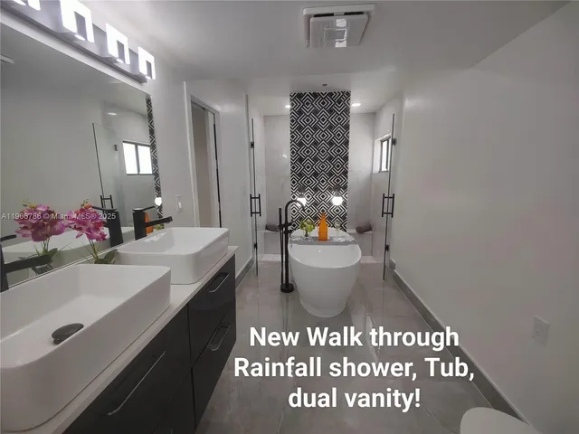 a bathroom with a sink and mirror