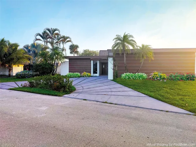 a bathroom with a sink a toilet a mirror and shower