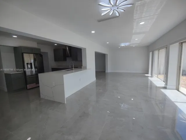 a view of an empty room with a balcony