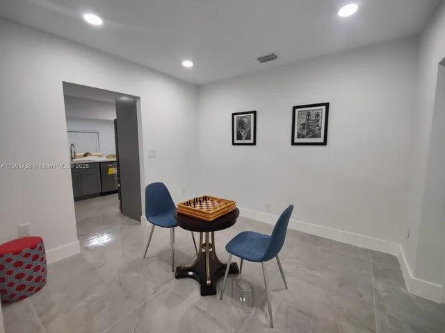 a view of a workspace with furniture