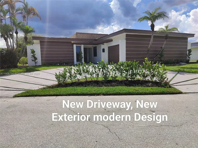 a view of front of house with a garden