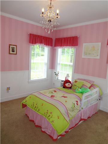 2059 Crescentview Road Pulaski, TN 38478 - Photo 15 of 20 a bedroom with a bed mirror and window