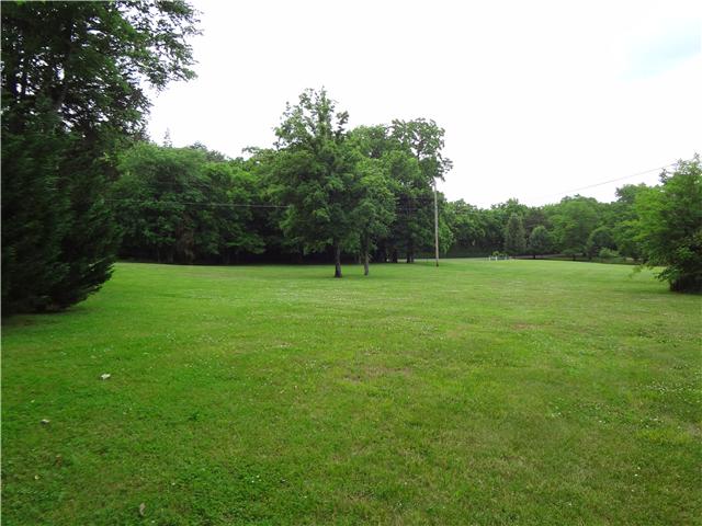 2059 Crescentview Road Pulaski, TN 38478 - Photo 19 of 20 a view of a grassy field with trees