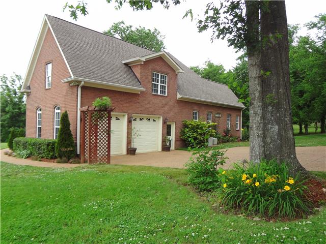 2059 Crescentview Road Pulaski, TN 38478 - Photo 3 of 20 a front view of a house with garden