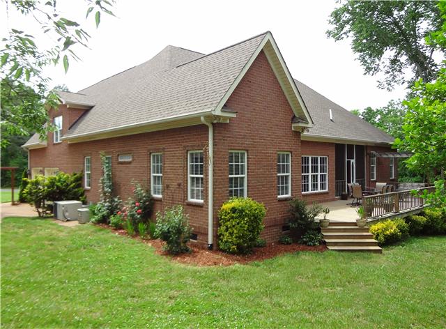 2059 Crescentview Road Pulaski, TN 38478 - Photo 4 of 20 a front view of a house with a garden and porch