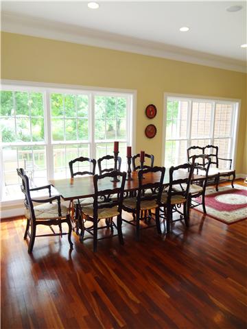 2059 Crescentview Road Pulaski, TN 38478 - Photo 8 of 20 a view of a dining room with furniture and wooden floor