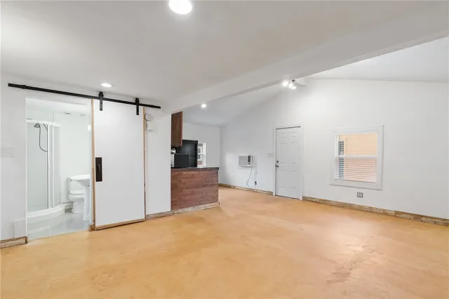 a view of an empty room with a cabinet