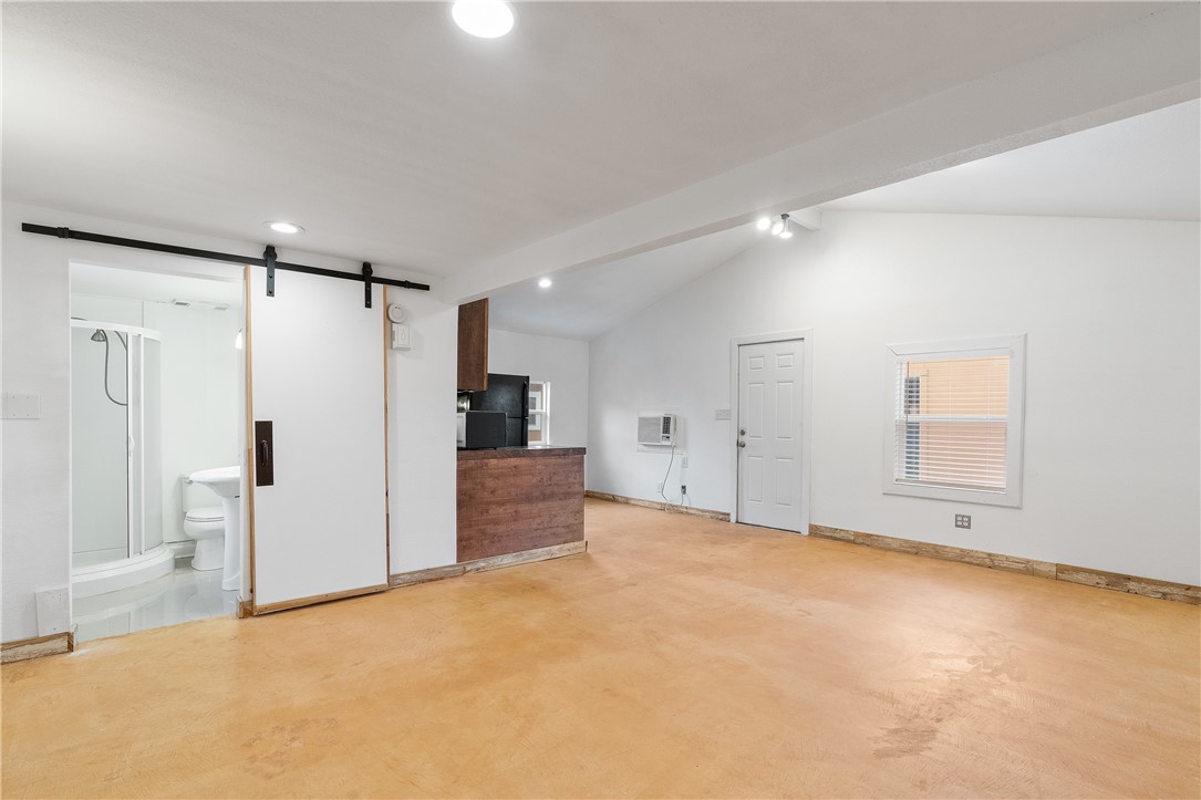 4414 Diane Drive, Unit 1B Austin, TX 78745 - Photo 2 of 15 a view of an empty room with a cabinet