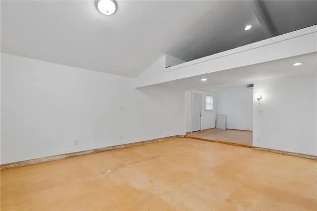 an empty room with a empty space and window