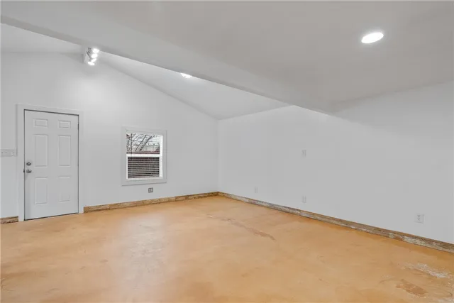 an empty room with a empty space and a window