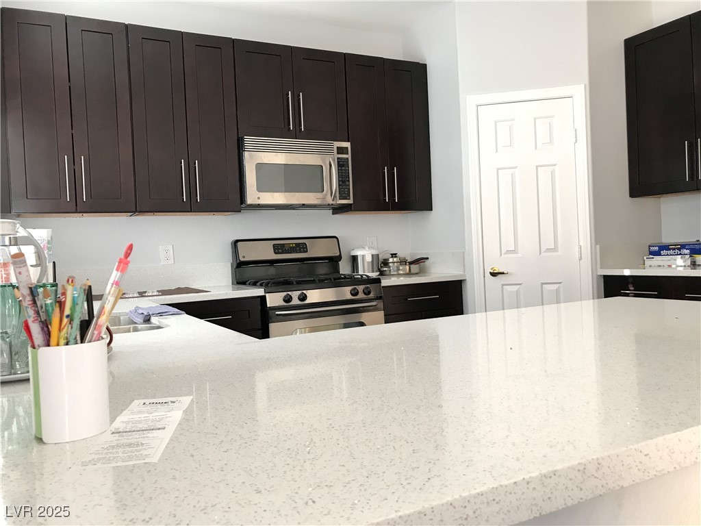 5423 Dancing Bear Drive Las Vegas, NV 89113 - Photo 16 of 18 Kitchen with appliances with stainless steel finis